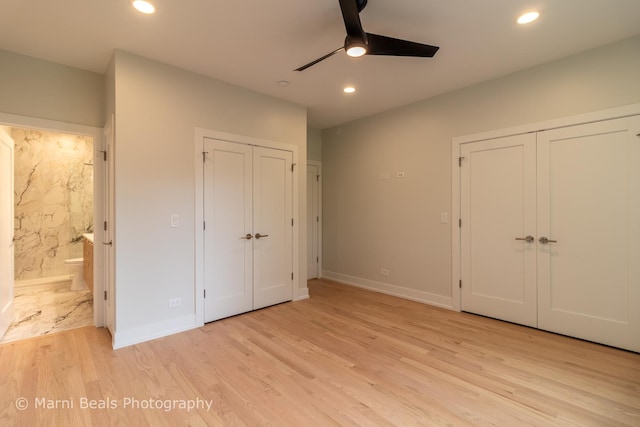 6517 S Saint Lawrence Ave, Chicago, IL 60637 - unfurnished bedroom with two closets, recessed lighting, connected bathroom, and light wood finished floors