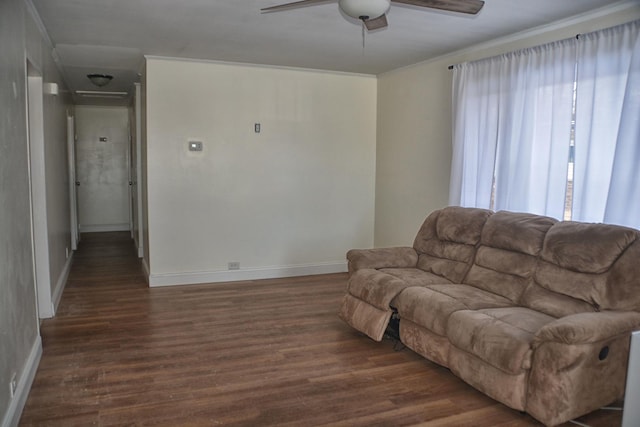 living room with ceiling fan, ornamental molding, and dark hardwood / wood-style floors