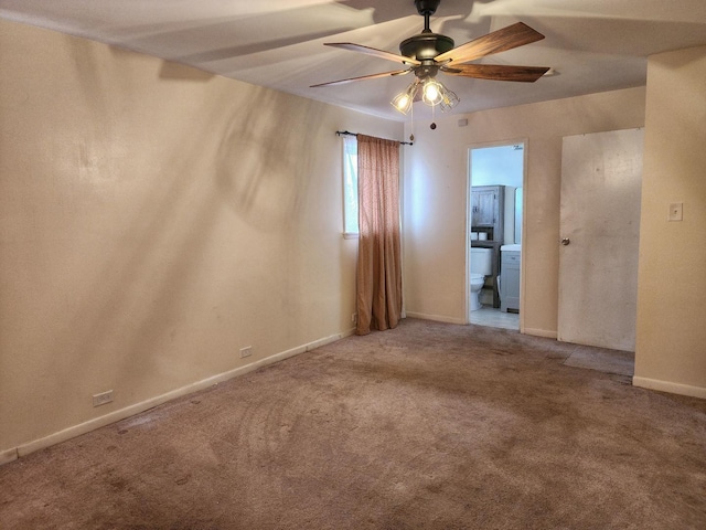 spare room featuring carpet floors and ceiling fan