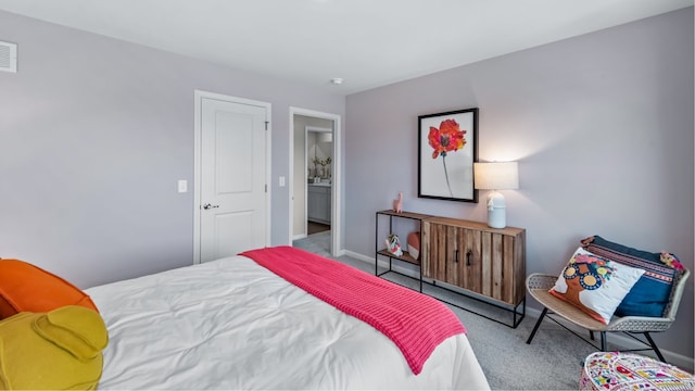 bedroom featuring light carpet