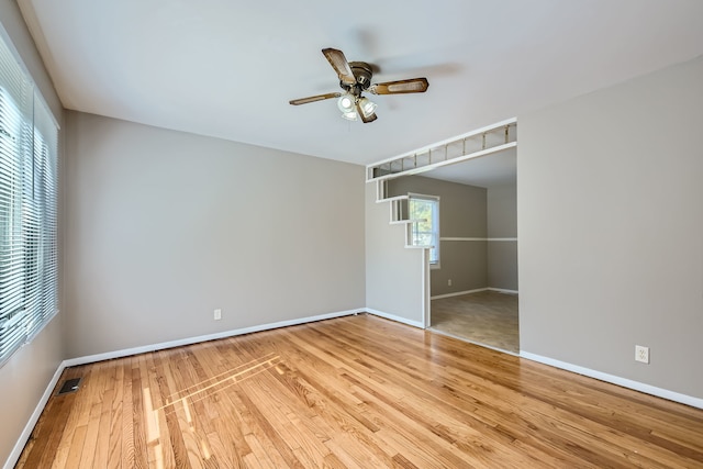 unfurnished room featuring light wood-type flooring and ceiling fan