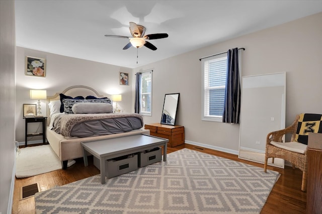 bedroom featuring ceiling fan and dark hardwood / wood-style flooring