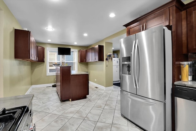 kitchen featuring stainless steel appliances and a kitchen island