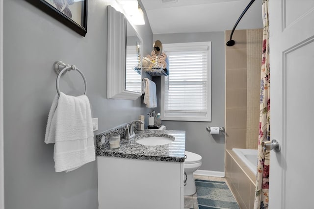 full bathroom featuring shower / bath combo with shower curtain, tile patterned flooring, vanity, and toilet