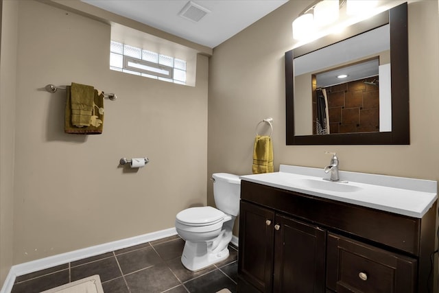 bathroom with a shower with shower curtain, tile patterned flooring, vanity, and toilet