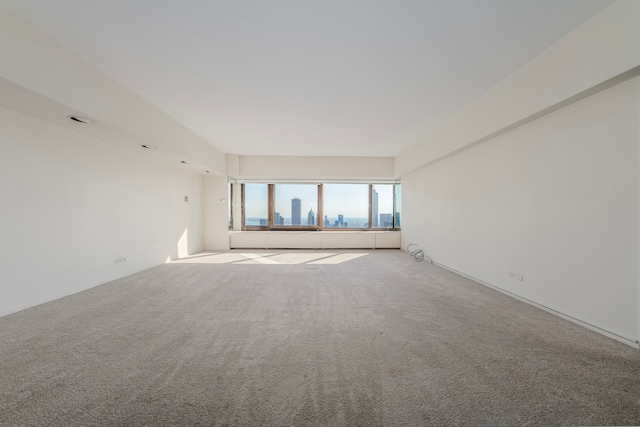 empty room with light colored carpet