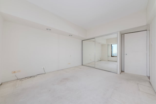 unfurnished bedroom featuring a closet