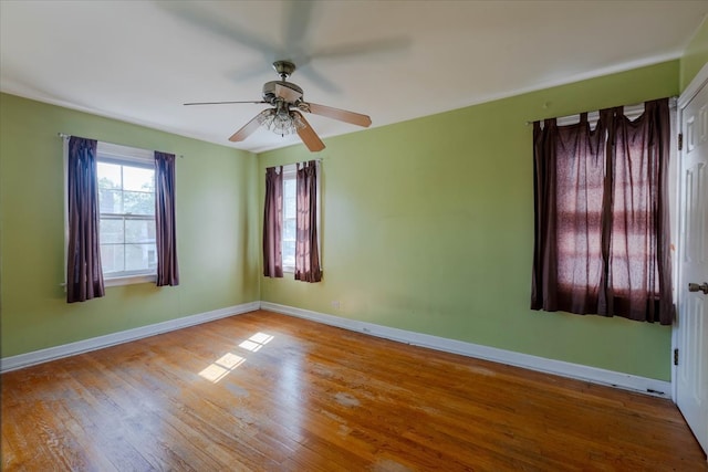 spare room featuring light wood-type flooring and ceiling fan