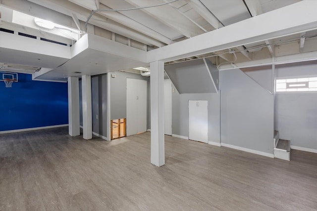 basement featuring hardwood / wood-style flooring