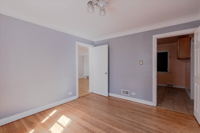 unfurnished room featuring light hardwood / wood-style flooring