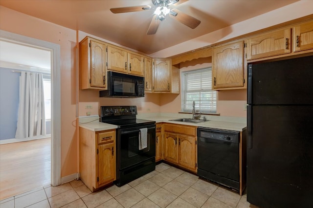 kitchen with ceiling fan, light tile patterned floors, sink, and black appliances