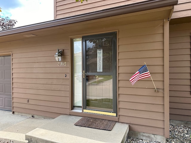 property entrance with a garage