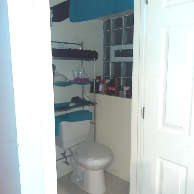 bathroom featuring tile patterned floors and toilet