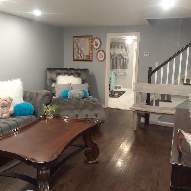 living room featuring dark hardwood / wood-style flooring