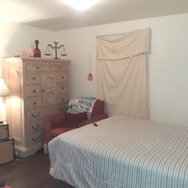 bedroom featuring dark wood-type flooring