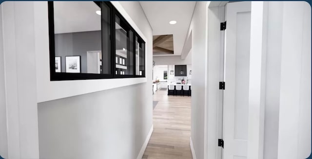 corridor featuring light hardwood / wood-style flooring