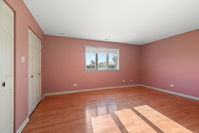 unfurnished bedroom with light hardwood / wood-style floors