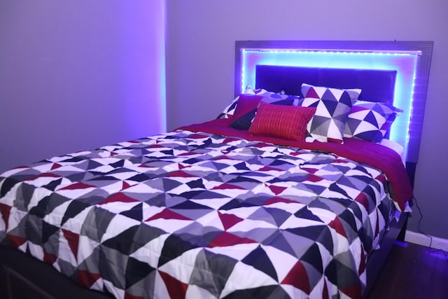 bedroom with wood-type flooring