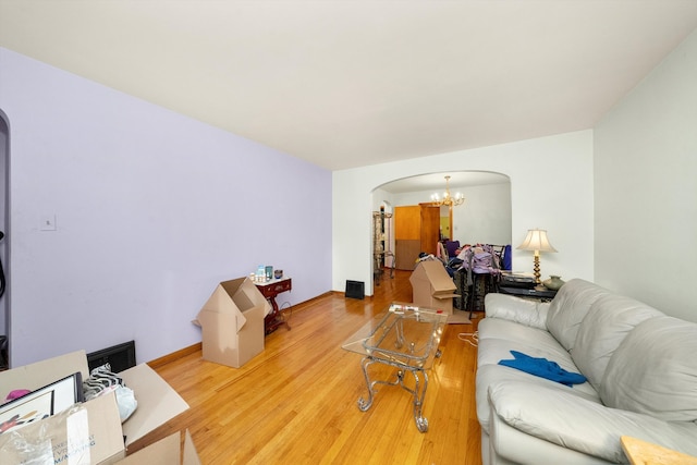 living room featuring a notable chandelier and hardwood / wood-style floors