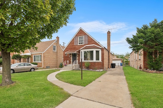 view of front of home featuring a front lawn and a garage