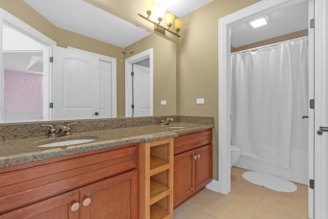 bathroom featuring tile patterned flooring, walk in shower, vanity, and toilet