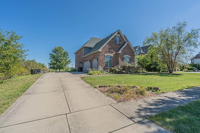 view of front property with a garage and a front lawn