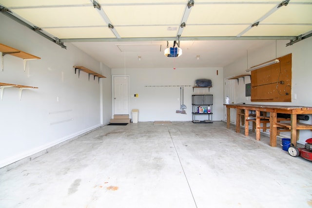 garage featuring a garage door opener and electric panel