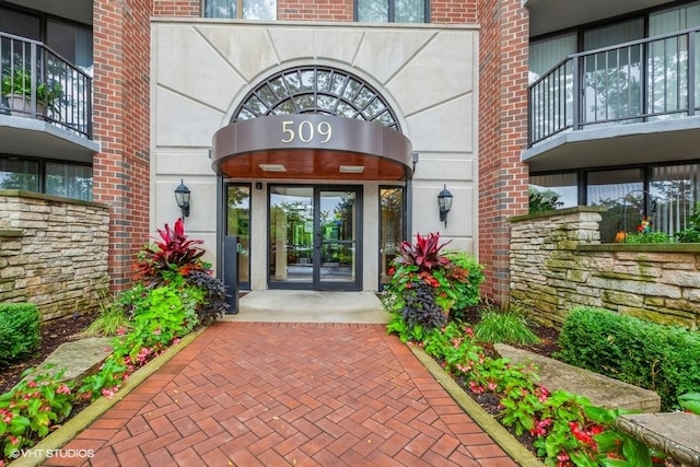 doorway to property with french doors and a balcony