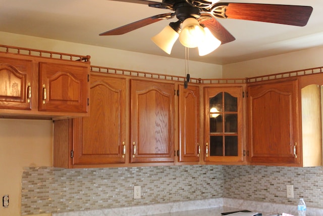 kitchen featuring ceiling fan and tasteful backsplash