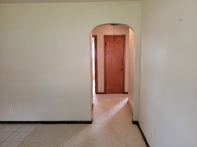 interior space featuring light carpet