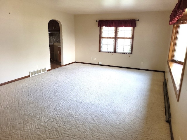 empty room with carpet flooring