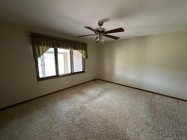 carpeted empty room with ceiling fan