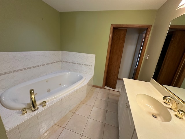 bathroom with tile patterned floors, tiled bath, and vanity