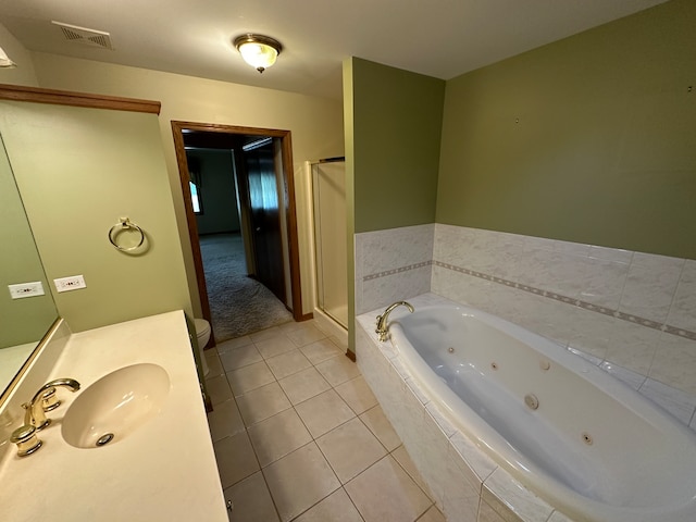 full bathroom with shower with separate bathtub, tile patterned flooring, vanity, and toilet