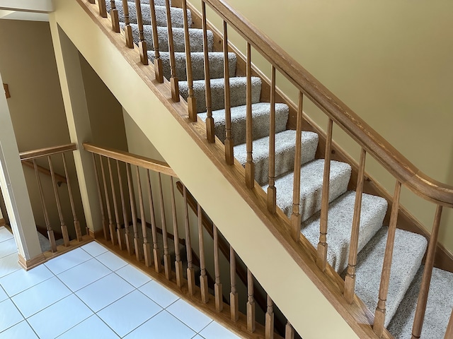 stairs featuring tile patterned floors