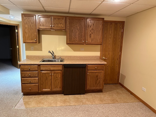 kitchen with light carpet, sink, a paneled ceiling, and dishwashing machine