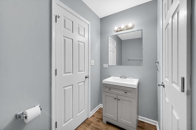 bathroom with vanity and hardwood / wood-style flooring