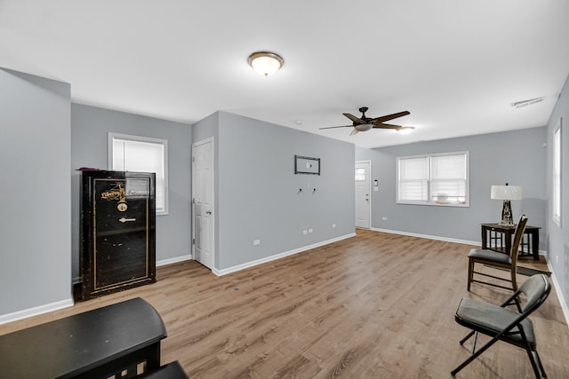 interior space with light wood-type flooring and ceiling fan