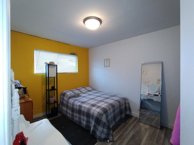 bedroom featuring dark hardwood / wood-style flooring