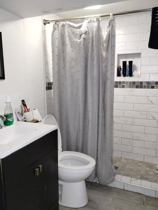 bathroom with vanity, toilet, and a shower with curtain