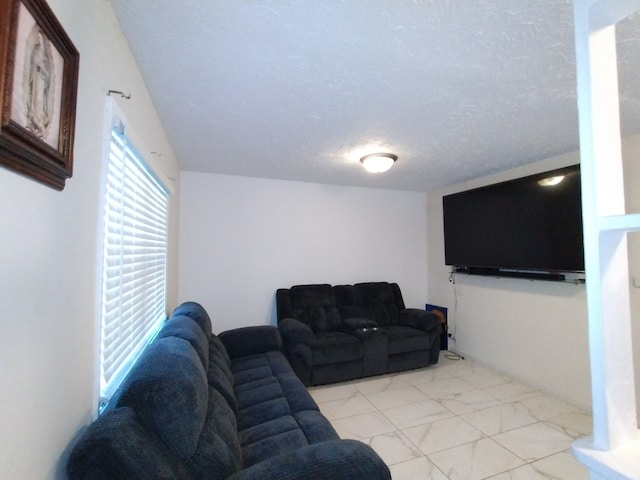 living room with a textured ceiling