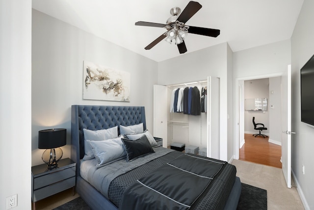 carpeted bedroom with a closet and ceiling fan