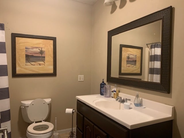 bathroom featuring vanity and toilet