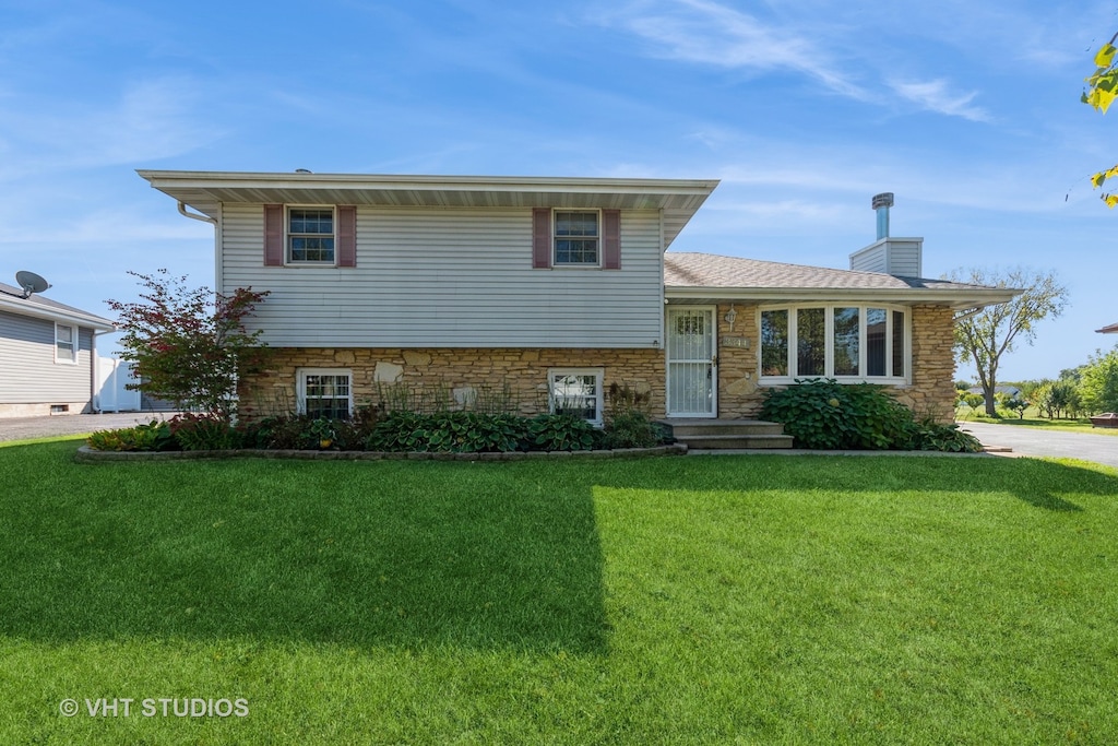 split level home with a front yard