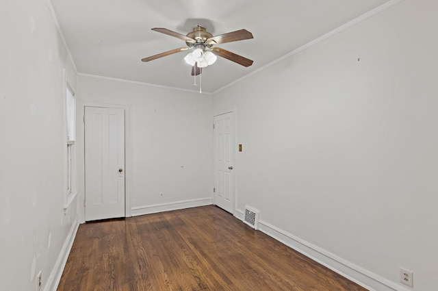 spare room featuring ceiling fan, ornamental molding, and dark hardwood / wood-style flooring