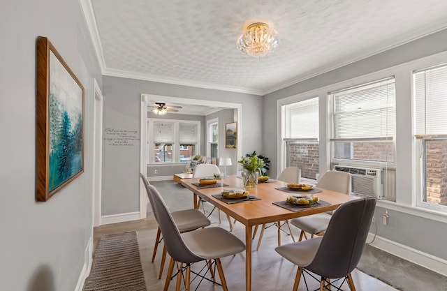 dining room featuring a textured ceiling, crown molding, ceiling fan, and cooling unit