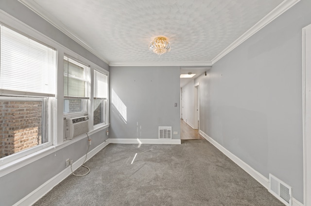 empty room featuring a healthy amount of sunlight, carpet, and cooling unit