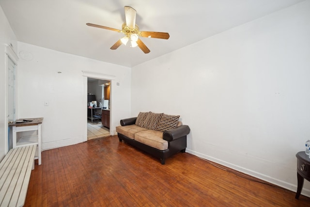 sitting room featuring ceiling fan and hardwood / wood-style floors