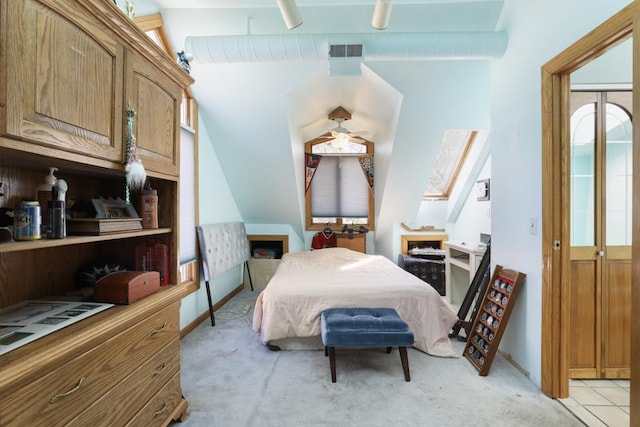 bedroom featuring visible vents and light carpet