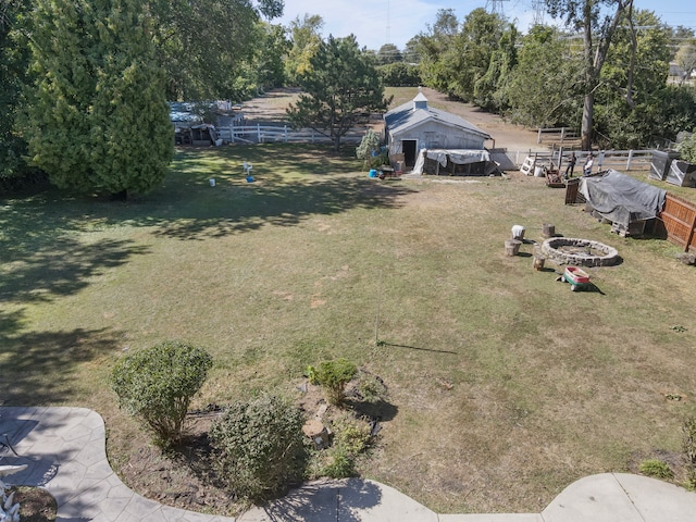 view of yard with a fire pit